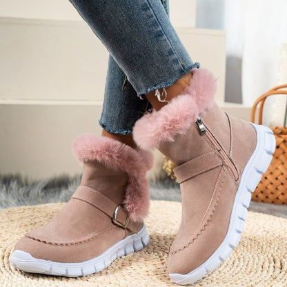 Angled view of pink plush ankle winter boots with stylish buckle and warm faux fur lining