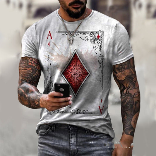 A man with tattoos is wearing the Men's Ace of Diamonds Graphic T-Shirt, showcasing a unique and stylish design, as he intently looks at his smartphone.