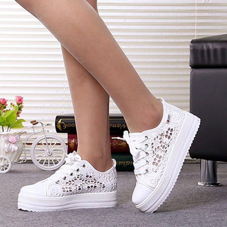 Woman wearing breathable mesh lace up shoes