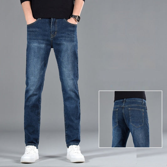 A person dressed in New Slim Fit Youth Casual Straight-leg Cotton Jeans Men and white sneakers is positioned against a gray background. The inset image features the rear view of these men's denim jeans, emphasizing the straight-leg fit and detailed pocket stitching.