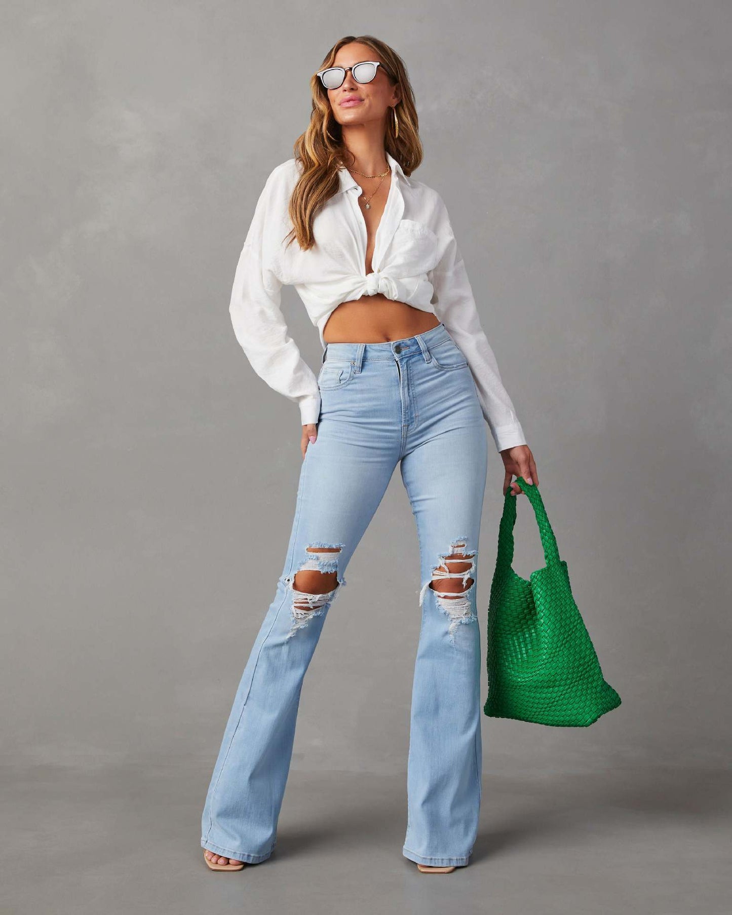 Stylish distressed wide-leg jeans front view