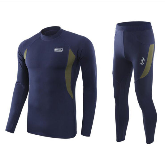 This Men's Athletic Compression Set features a long-sleeve top and leggings in navy blue, made from moisture-wicking fabric. The design is enhanced with olive green side panels and a small logo on the chest and thigh, providing muscle support for optimal comfort.