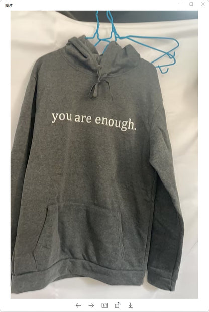 Front view of unisex hoodie with inspirational quote