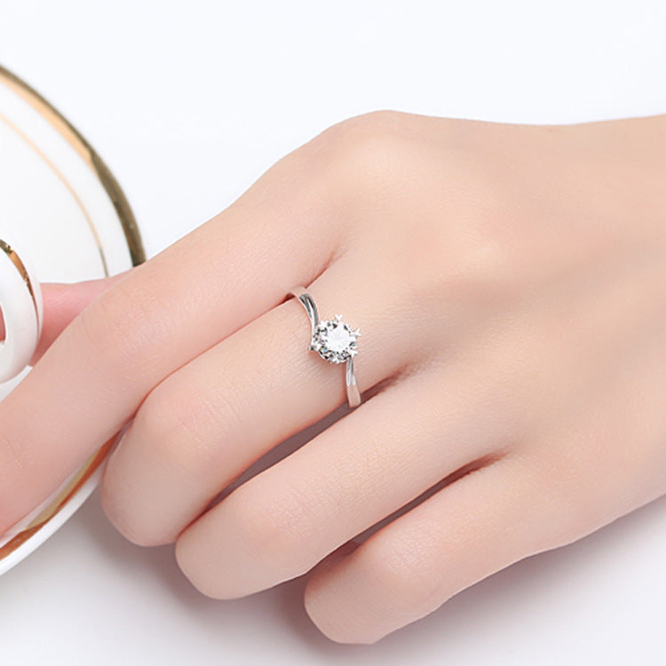 Close-up of the Classic Snowflake Ring showing its stunning snowflake motif and sparkling center stone