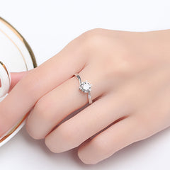 Close-up of the Classic Snowflake Ring showing its stunning snowflake motif and sparkling center stone