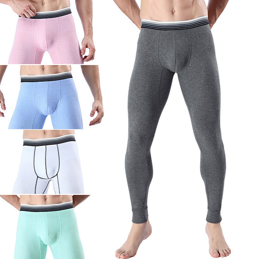 A person is barefoot, wearing gray Men's Thermal Stretch-Fit Leggings designed for warmth and comfort. On the left, four smaller images display leggings in pink, blue, white, and mint green, each with a black and white waistband made from ultra-soft fabric.