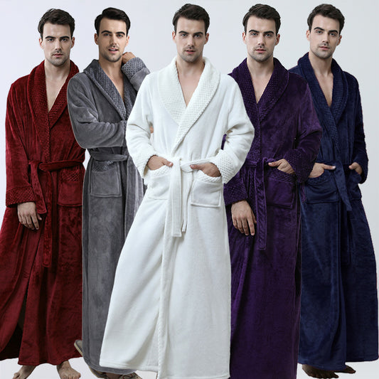 Five men wearing luxurious full-length flannel bathrobes with shawl collars stand in a row. The bathrobes, made from plush flannel material, showcase a variety of colors: red, gray, white, purple, and dark blue. Each man casually rests his hands in the pockets against a plain white background.