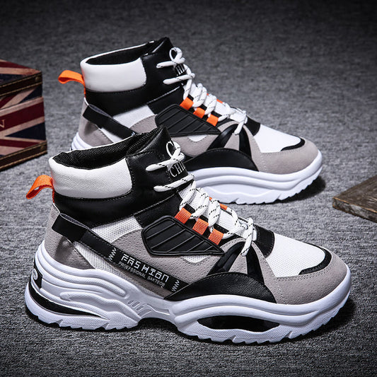 A pair of high-top fashion sneakers from CJ'S, these men's autumn footwear feature a sporty design with a mix of black, white, and gray colors accented by orange. They have chunky white and black soles, black and white mesh details, and orange pull tabs at the heel and on the laces.