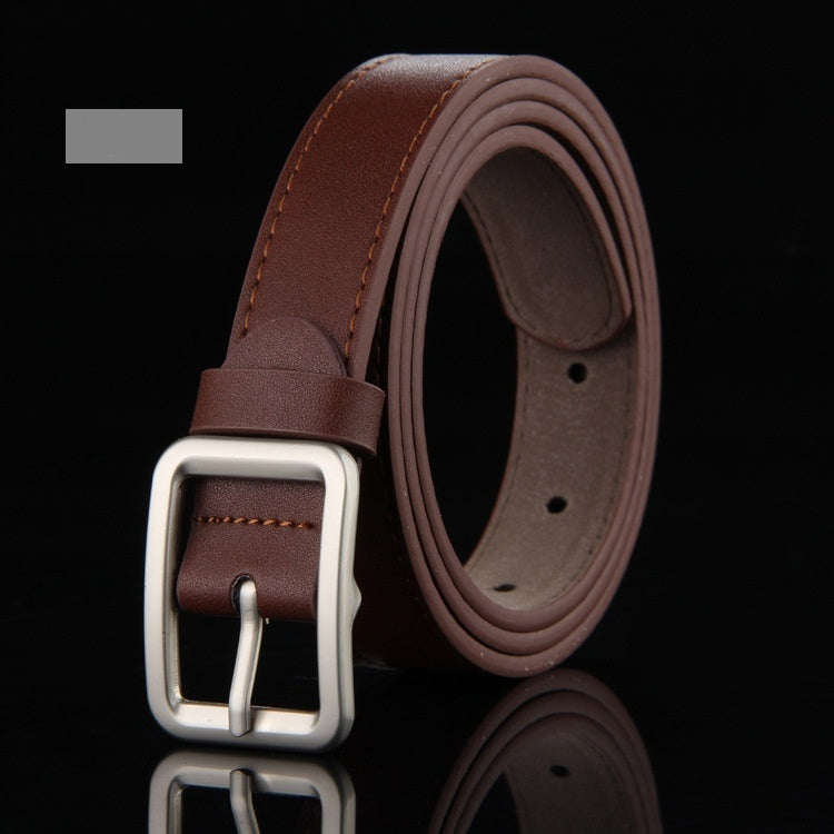 The CJ'S Men's Classic Genuine Leather Belt, displayed in a coiled roll, boasts a sleek metal single-prong buckle. Its versatile design is accentuated by stitched edges and multiple adjustment holes, with the details highlighted against a black background.