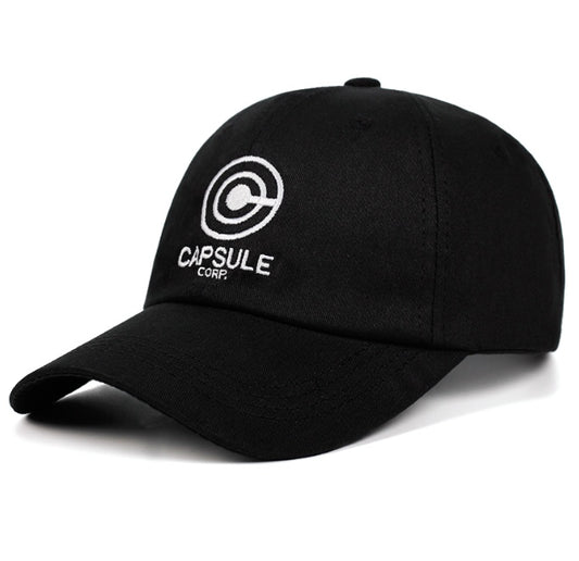 The Capsule Corp Embroidered Cotton Baseball Cap by CJ'S showcases a black design adorned with the iconic "Capsule Corp" logo and text. Featuring a stylized "C" with an additional concentric circle, followed by the words "CAPSULE CORP," this adjustable and stylish cap stands out against a plain white background, embodying timeless style.