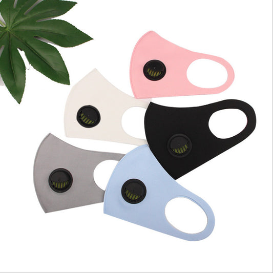 The Breather Valve ICE Cotton Mask by Zendrop is available in a fan arrangement of five colors: pink, white, black, gray, and blue. Each mask includes an exhalation valve for added comfort. A small green leaf is partly visible in the top left corner, enhancing these essential accessories with a natural element.