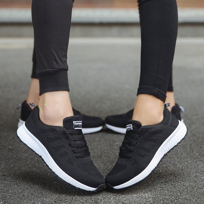 Black sports sneakers with white rubber outsole