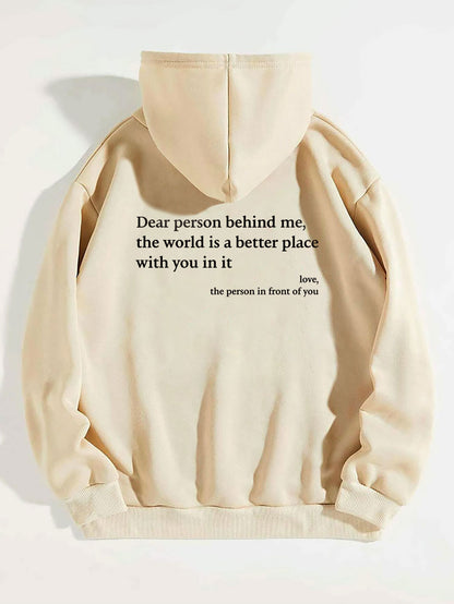 Close-up of printed message on beige hoodie