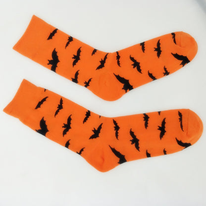 Halloween Bat Print Socks by CJ'S, offering a fun and festive spooky style with their moisture-wicking cotton fabric, are displayed flat on a white background.