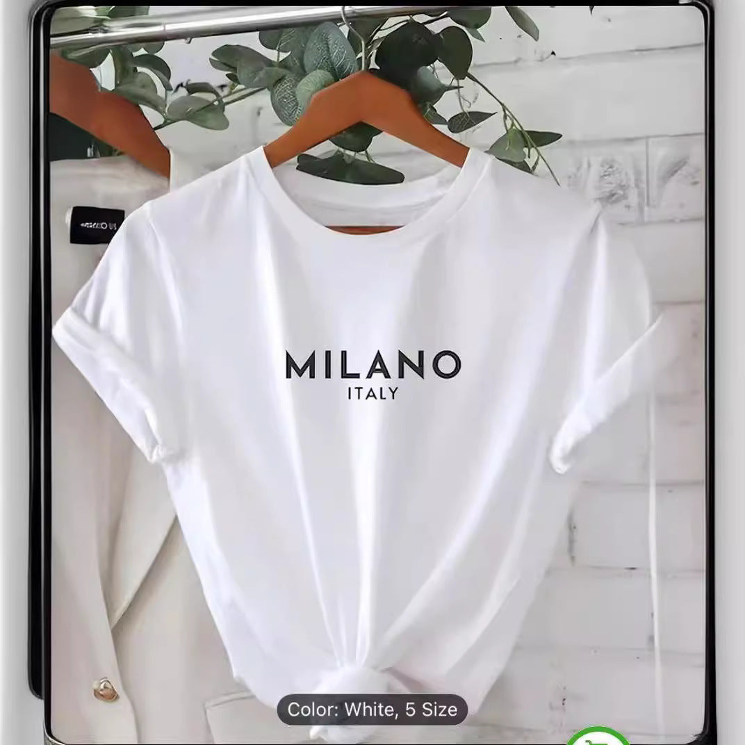 White T-shirt with MILANO ITALY print hanging on a wooden hanger