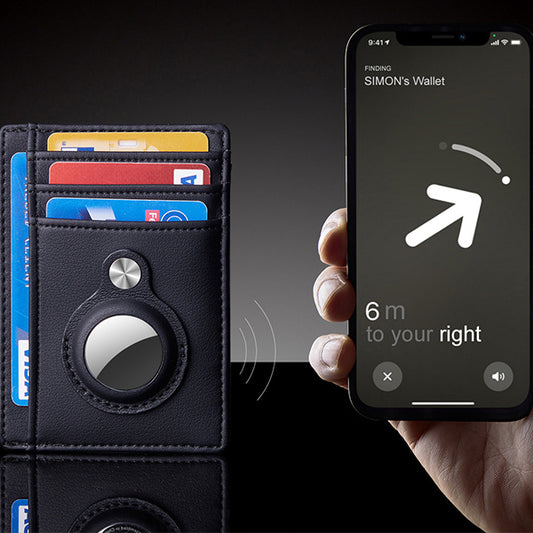 A hand holds a smartphone displaying a navigation screen indicating "SIMON's Wallet" is 6 meters to the right. Next to the phone is a black, CJ'S Men's Slim RFID Leather Wallet - AirTag Compatible, Anti-Theft Card Holder, containing multiple credit cards. The background is dark.