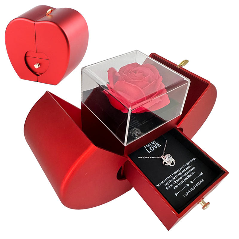 A CJ's Heart-Shaped Gift Box with Preserved Rose and Necklace is displayed both open and closed. Inside, it features a preserved rose under a clear cover and a necklace with a heart-shaped pendant in a drawer, accompanied by a romantic message.