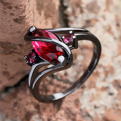 Black band ring with red crystals